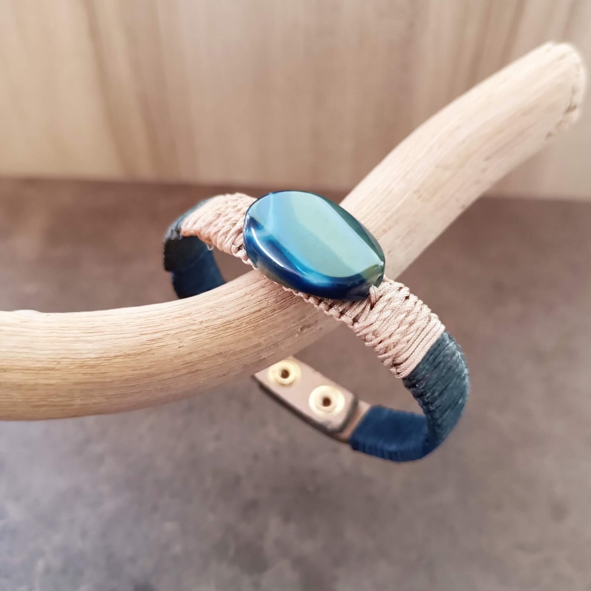 a leather bracelet with a blue agate stone close up stone view