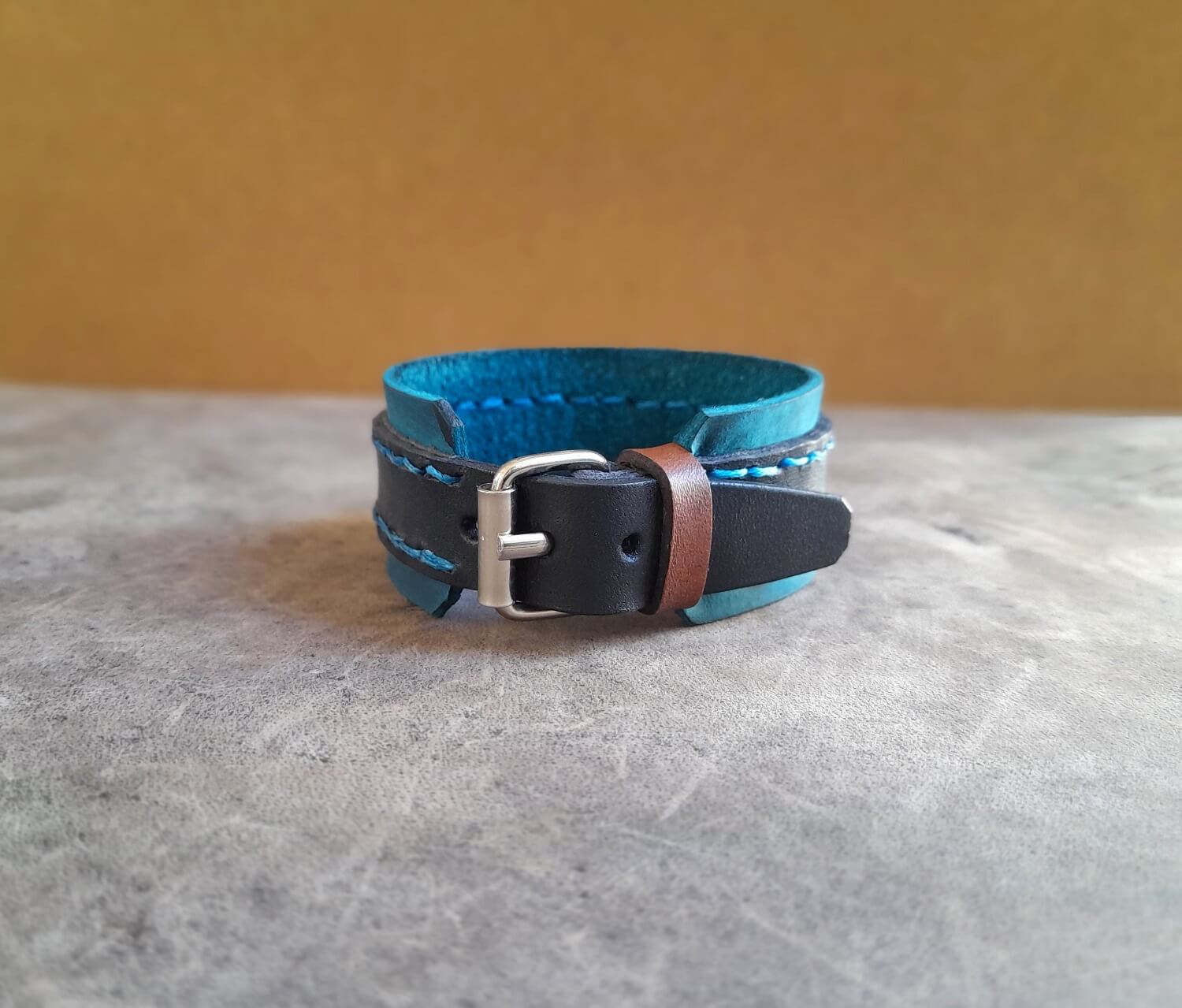 blue buckle leather cuff back view