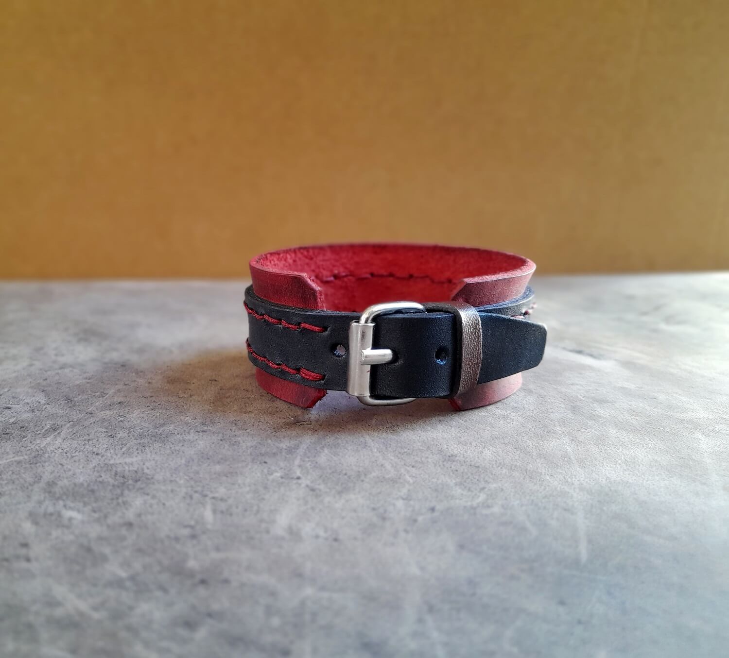 red buckle leather cuff back view
