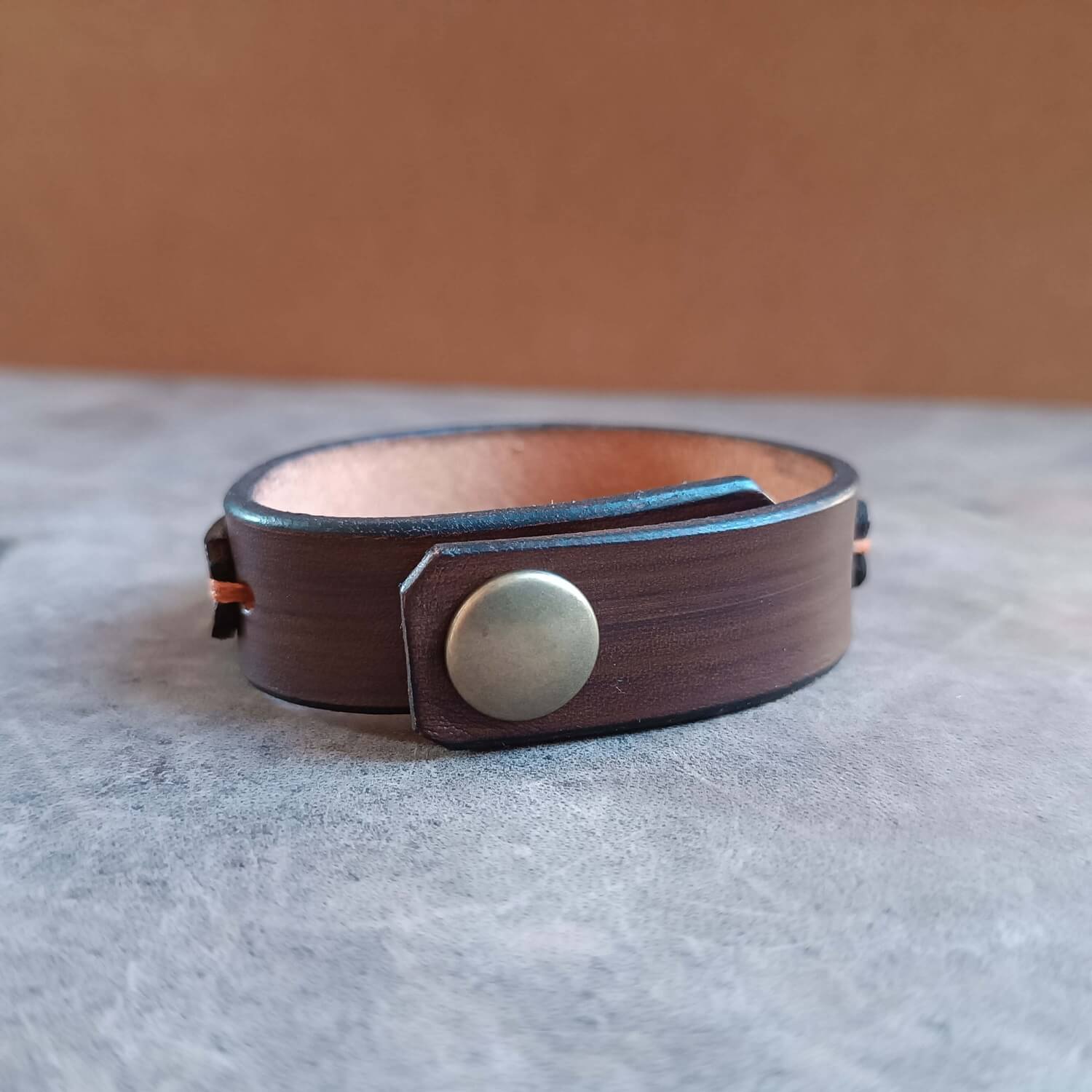 Celtic Shield Knot Leather Bracelet back view showing bronze capped snap button closure