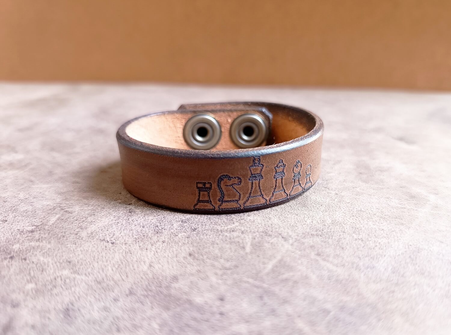 brown leather bracelet with engraved chess pieces