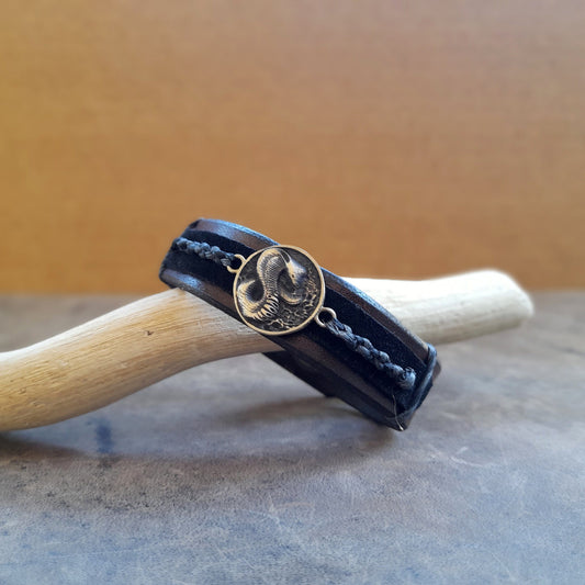 close up view of the cobra pendant and braided cord