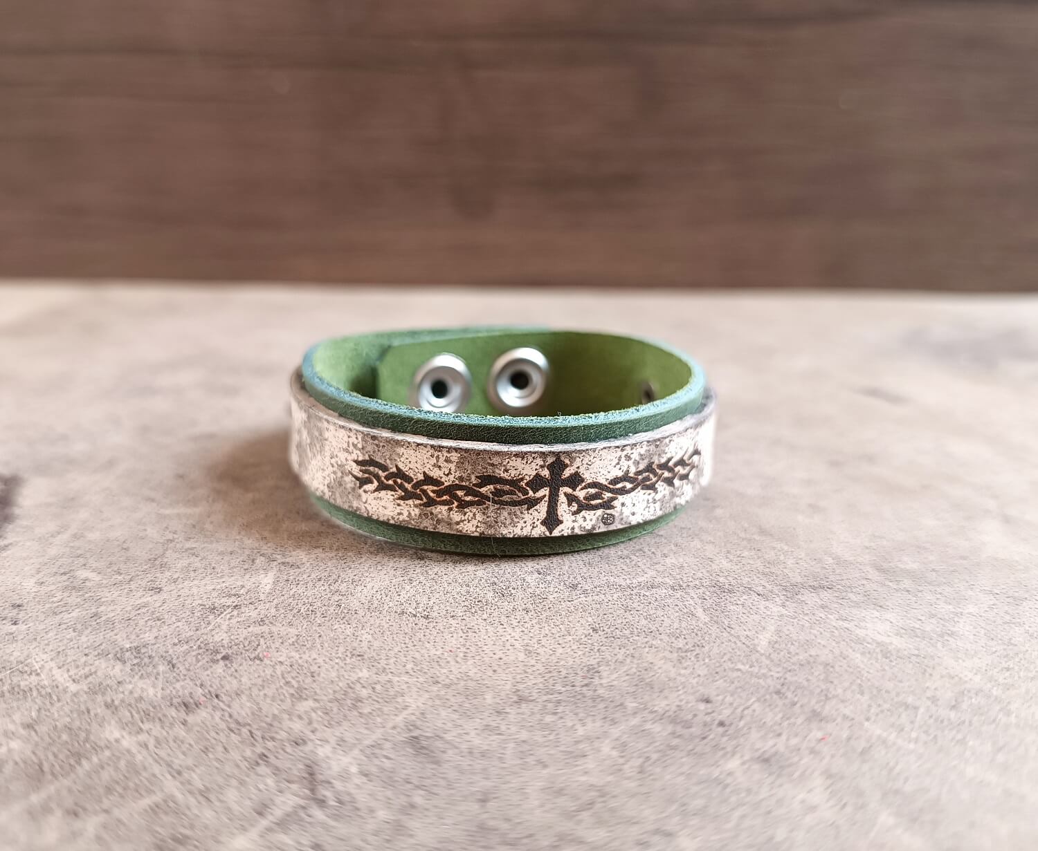 Green leather cuff with tribal flame and cross main photo