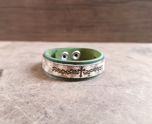 Green leather cuff with tribal flame and cross main photo