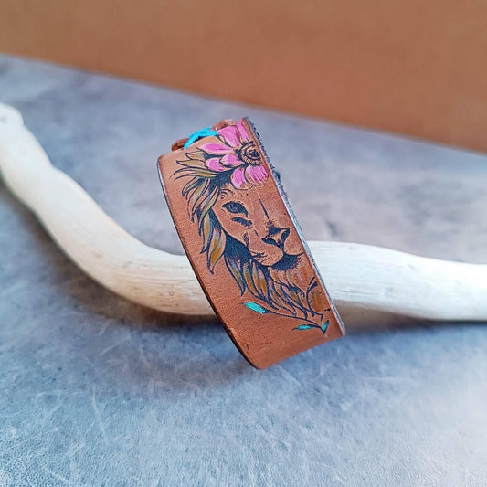brown leather bracelet with engraved lioness and hand painted flowers