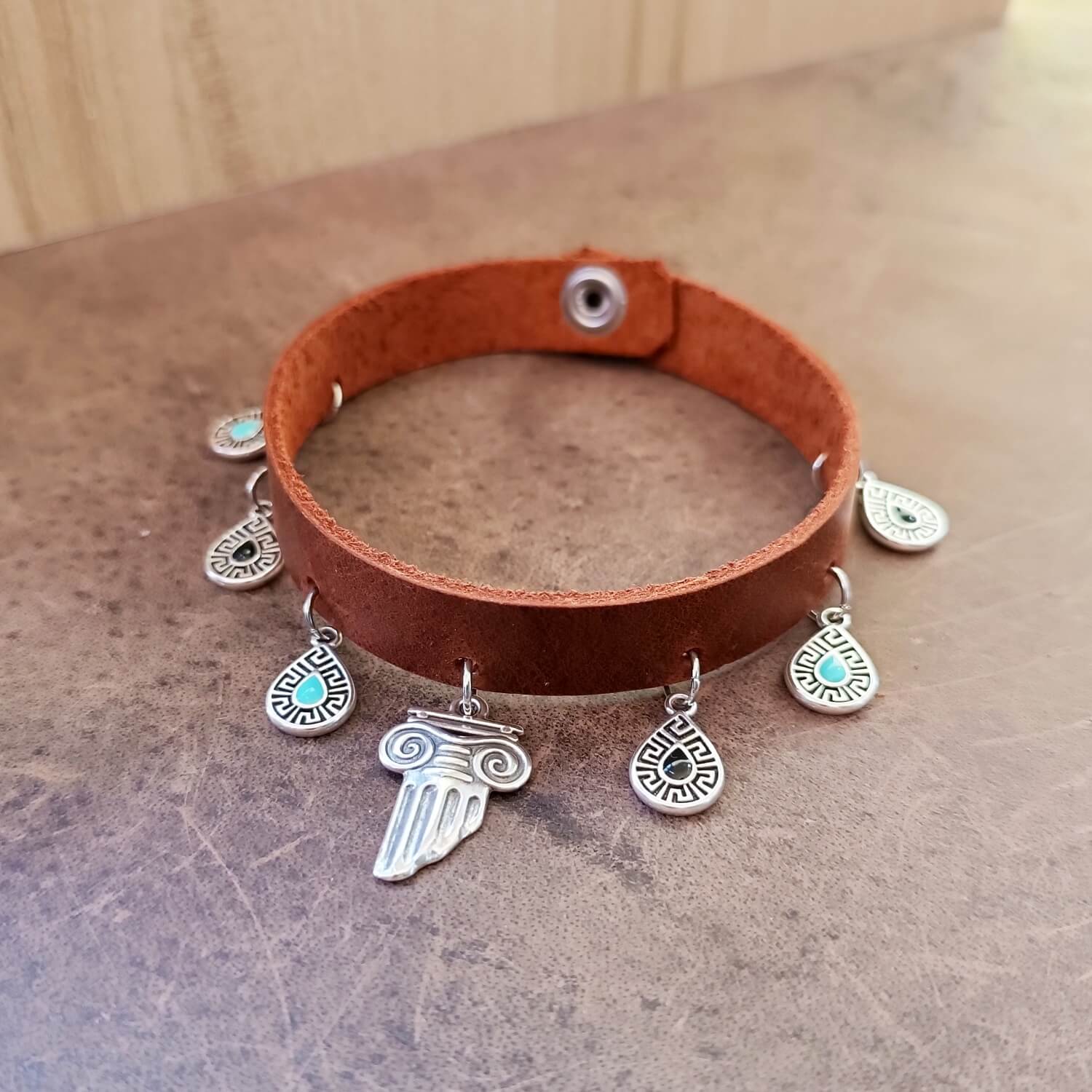 leather anklet with greek charms flat full view