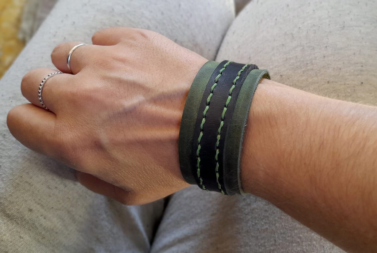green buckle cuff worn