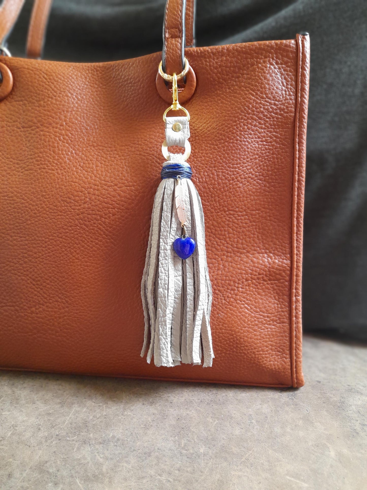Gray Leather Tassel Bag Charm with Gold Feather and Lapis Lazuli Heart Pendant