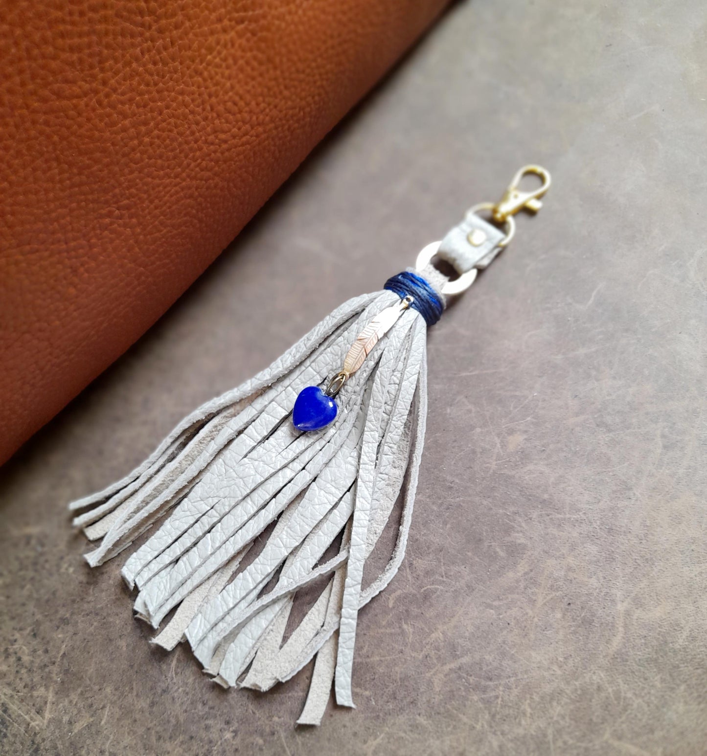 Gray Leather Tassel Bag Charm with Gold Feather and Lapis Lazuli Heart Pendant