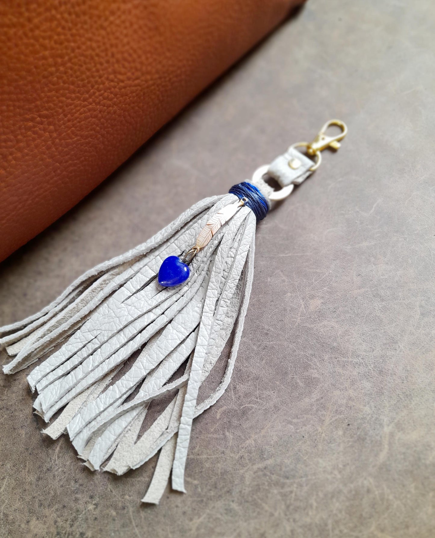 Gray Leather Tassel Bag Charm with Gold Feather and Lapis Lazuli Heart Pendant
