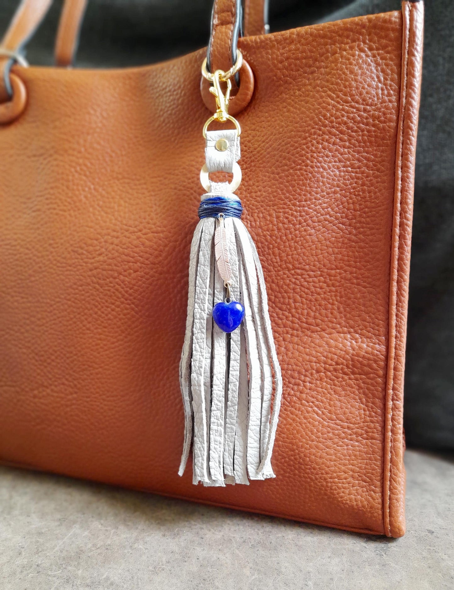 Gray Leather Tassel Bag Charm with Gold Feather and Lapis Lazuli Heart Pendant