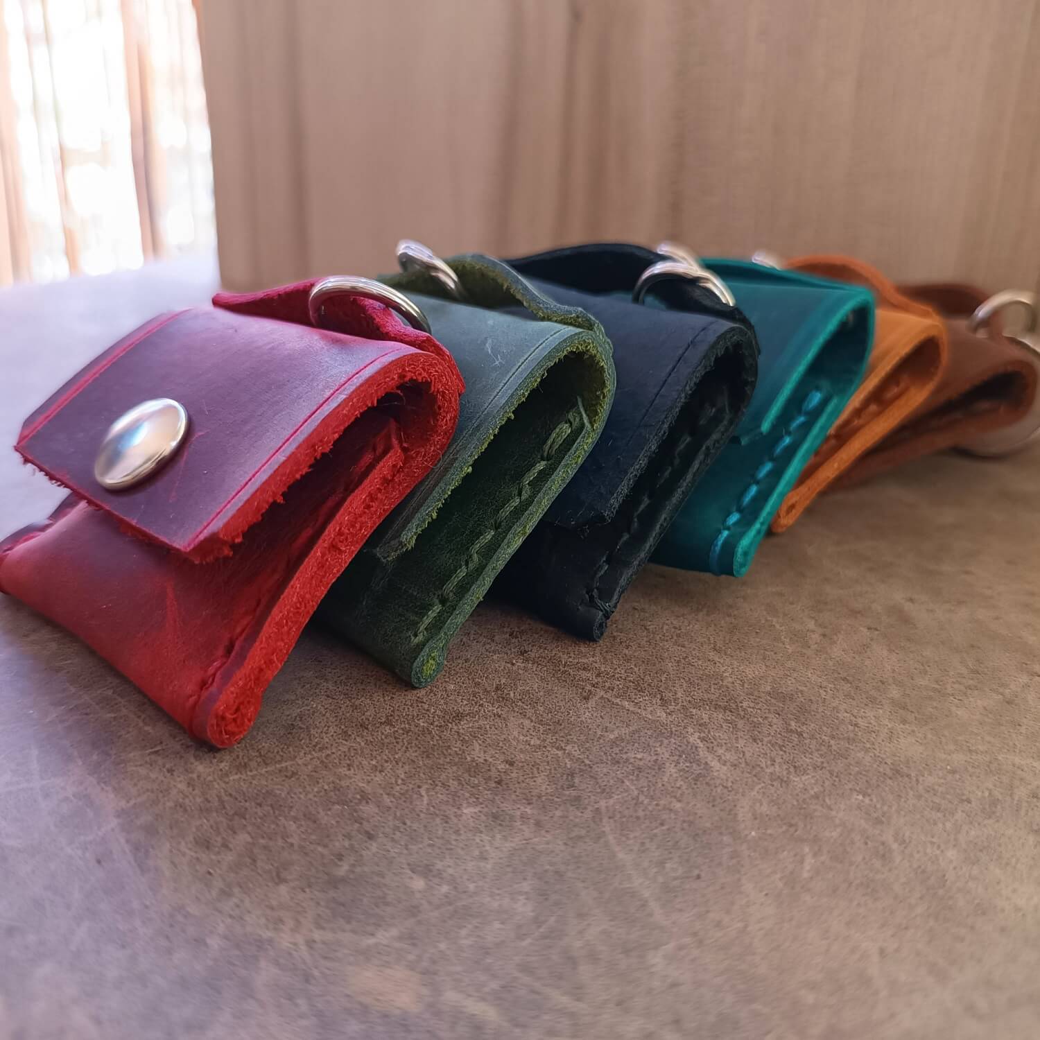 all variations of the leather ringholder keychain pouch