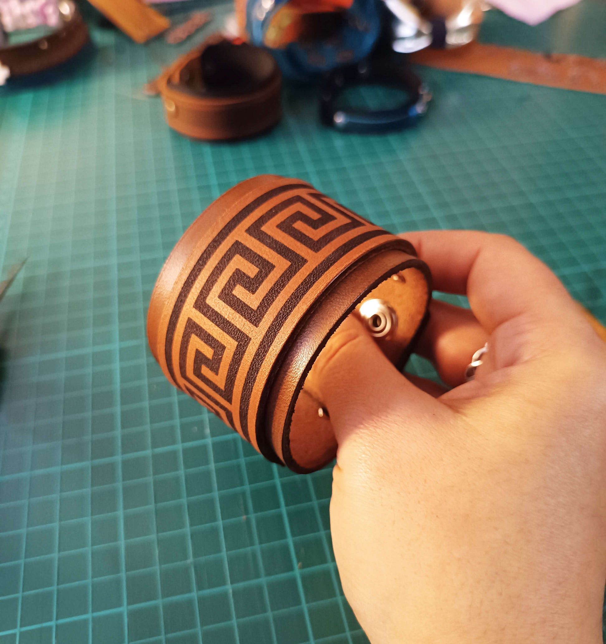 extra wide meander leather cuff on the making