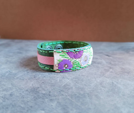 mossy green leather cuff with hand painted purple flowers side view