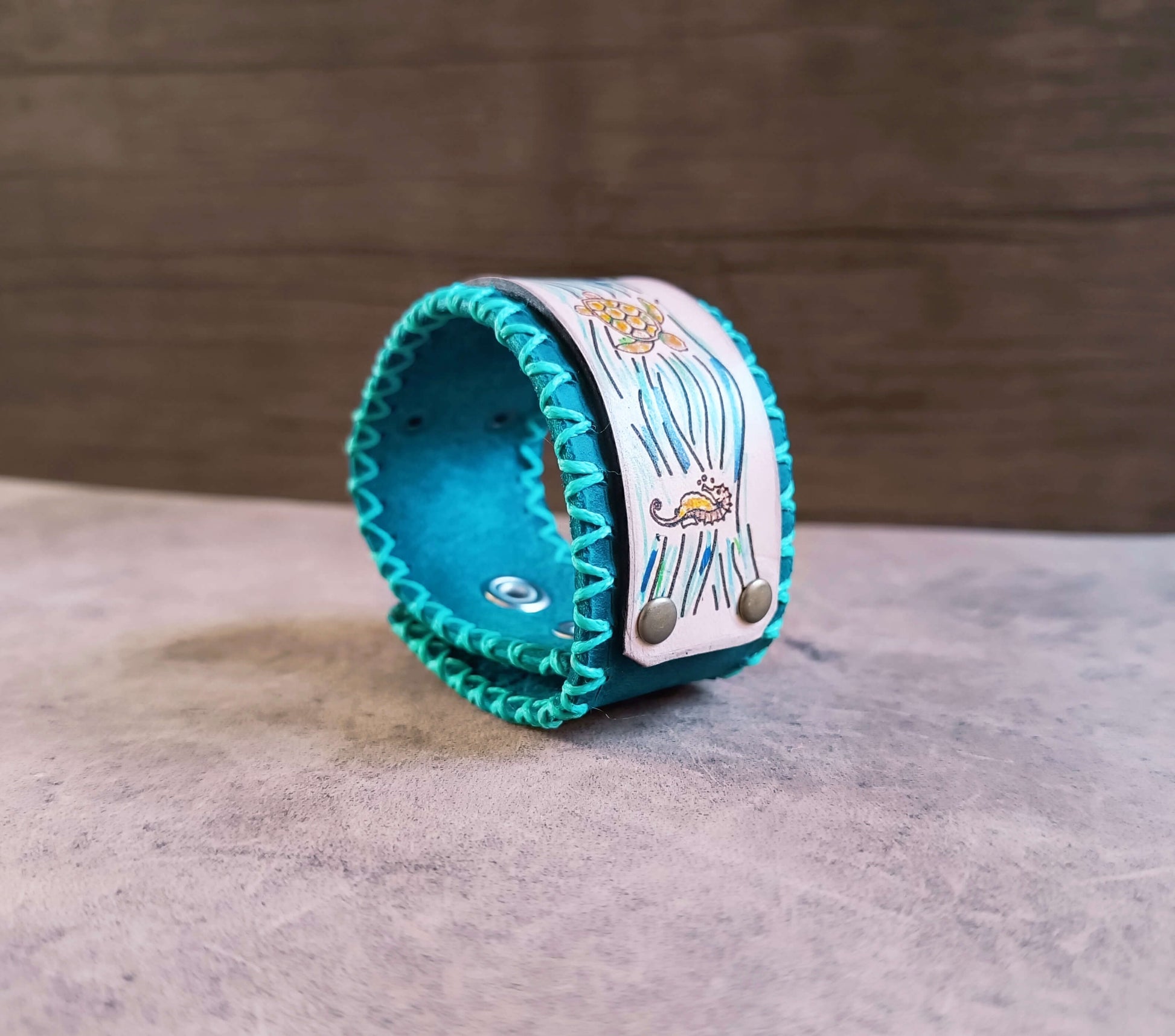 ocean themed leather cuff side view with underside