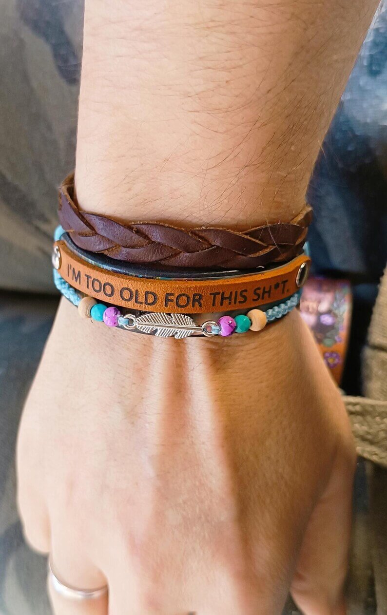 the "No BS" leather bracelet worn on wrist