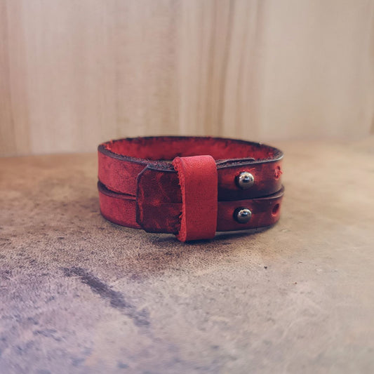 Unisex red leather cuff bracelet back view to show Crazy Horse texture and deep red tone