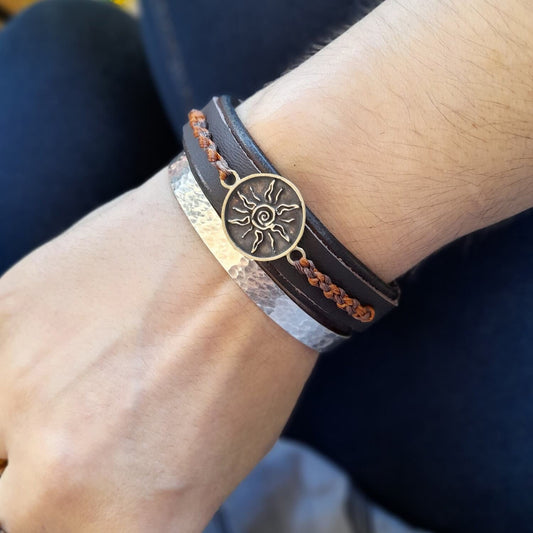 Styled image of Sunburst Bracelet worn on wrist, radiating warmth and showcasing genderless style