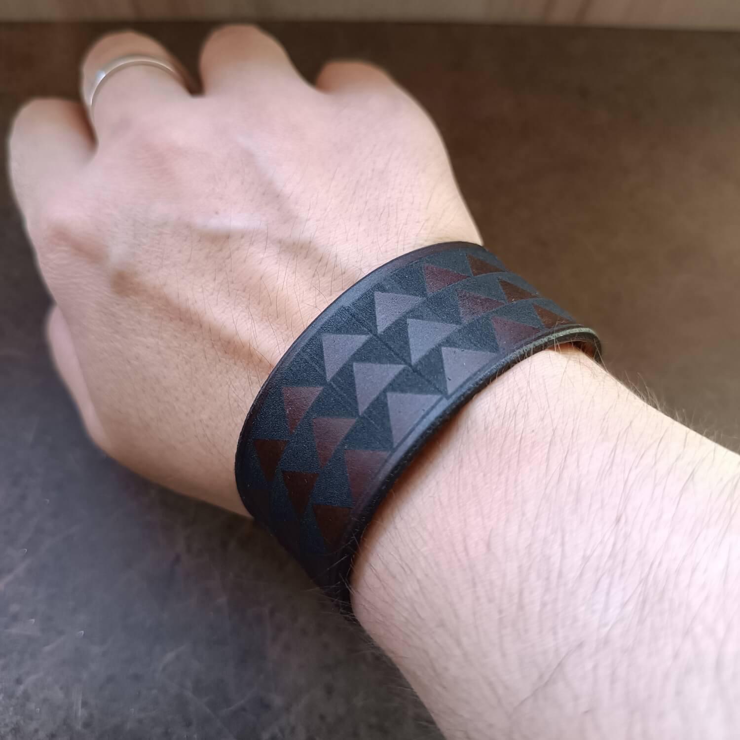 Samoan Tribal Leather Cuff Bracelet in dark brown leather, worn on wrist