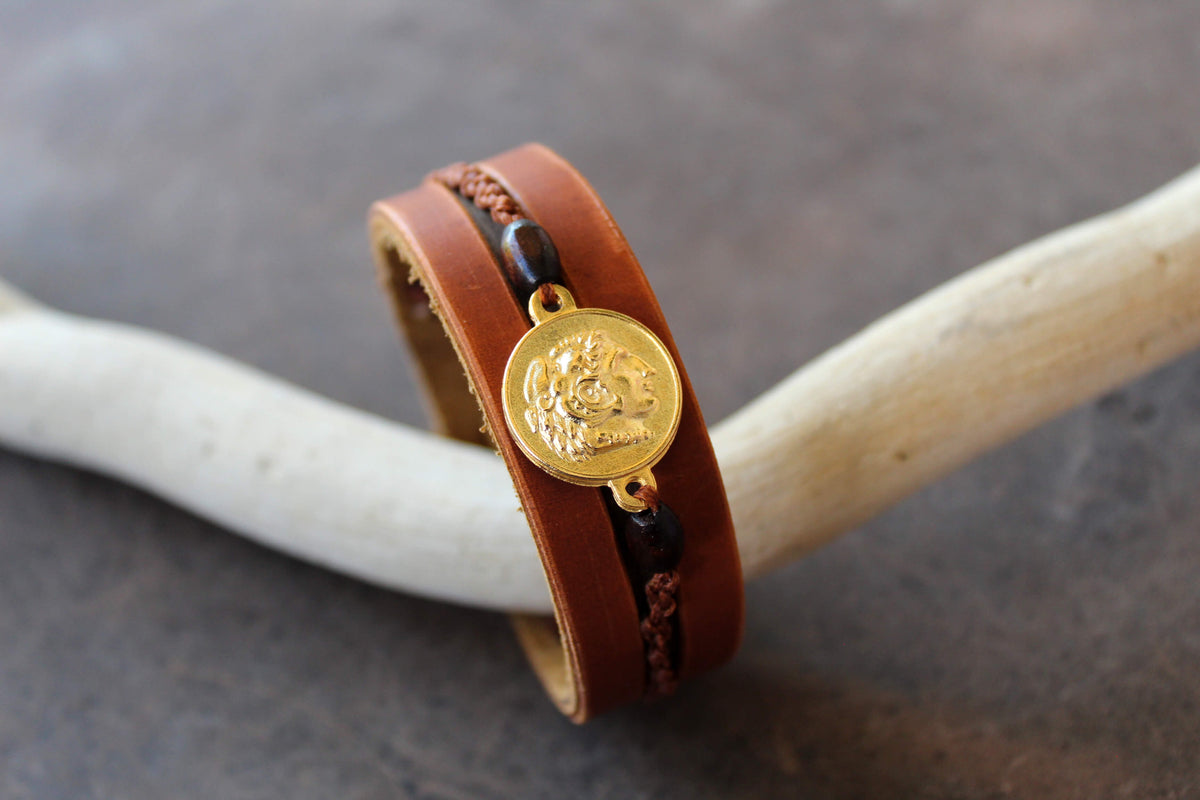 handmade brown leather cuff bracelet featuring a vergina sun and alexander the great pendant