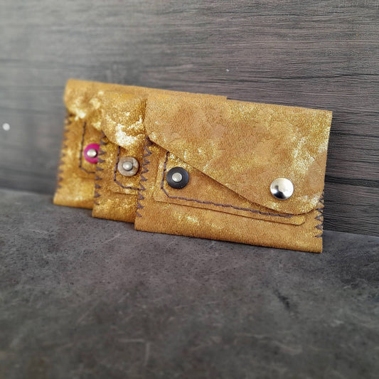 3 Gold upcycled leather mini wallets with vintage suede print, featuring a round coconut bead and snap button closure.