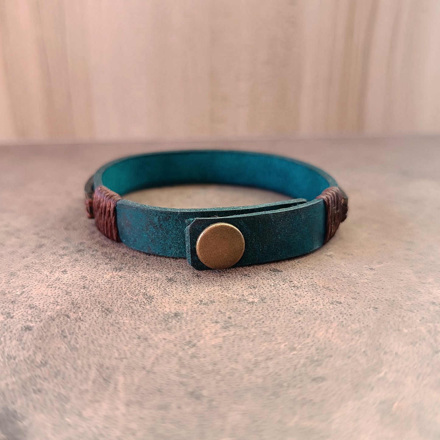 Back of Inner Compass Leather Bracelet, showing adjustable stainless steel antique bronze color snap button closure and area for free hidden personalization.