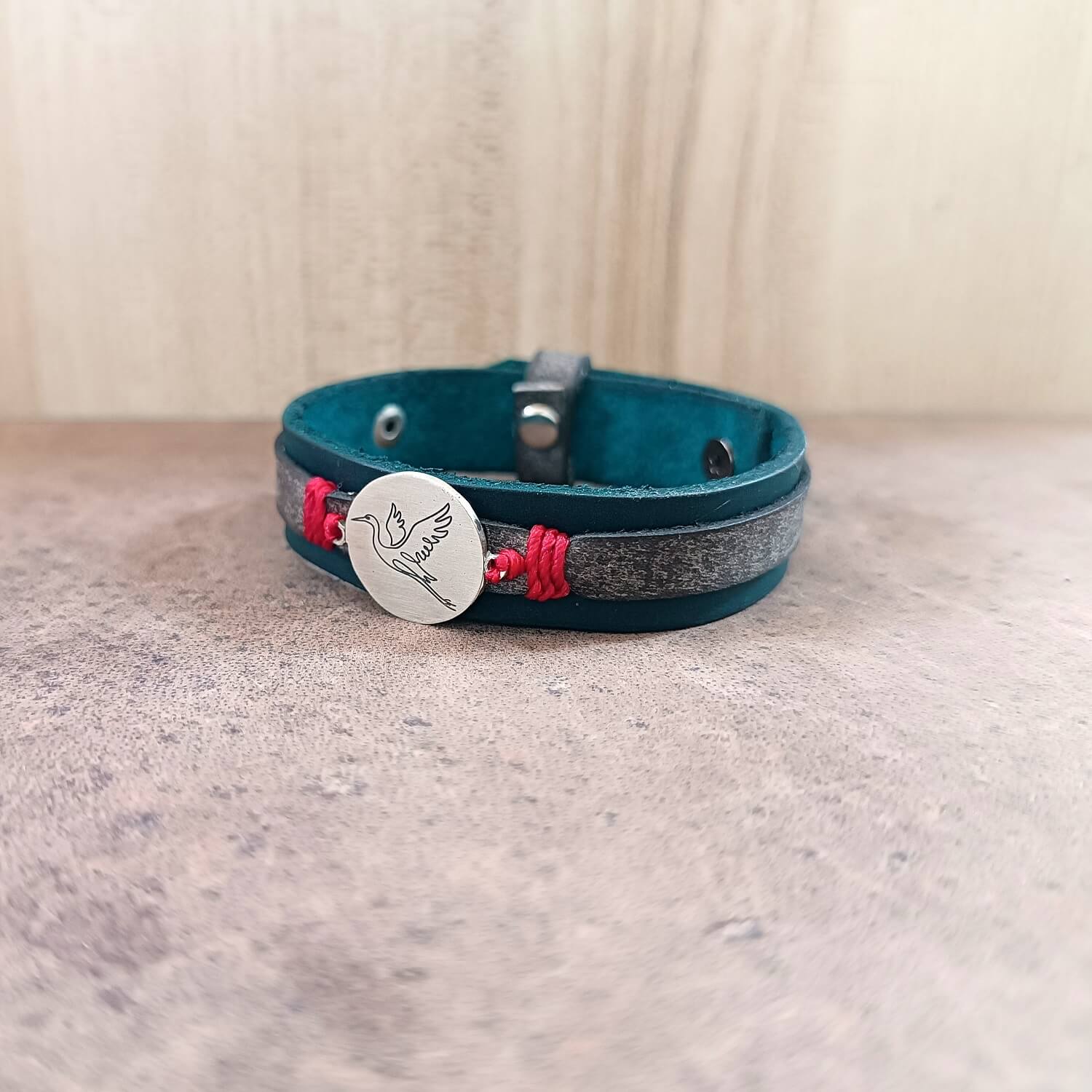 Indigo leather bracelet with crane pendant