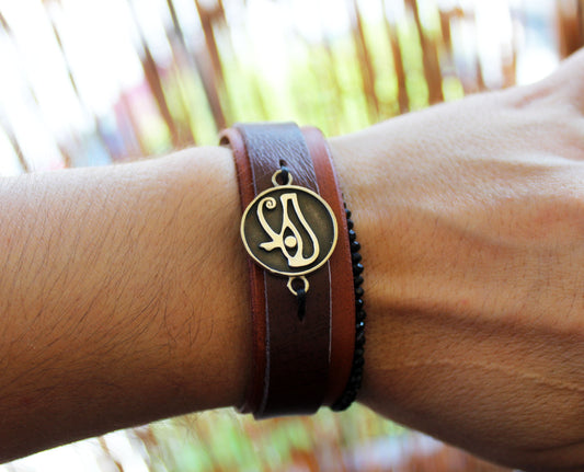 Eye of Horus leather bracelet worn on wrist