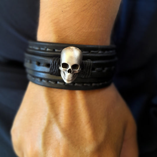 Men's Skull Leather Cuff worn on a wrist, showing comfortable fit and powerful presence.