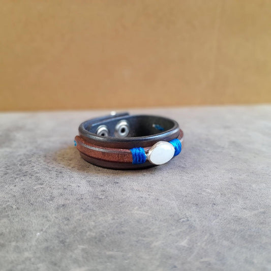 Natural Opal Leather Bracelet on Sterling Silver Pendant, showcasing the oval opal and chestnut brown leather.