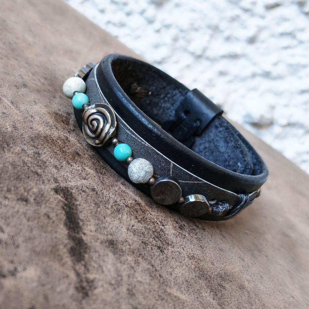 Black leather bracelet with silver spiral and semi precious beads close up view