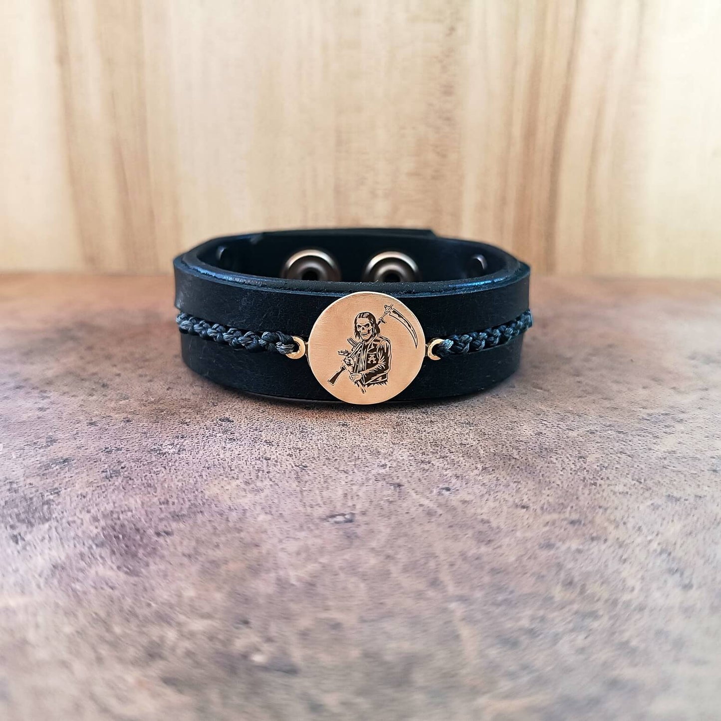 SAMCRO Black leather bracelet with a gold Reaper pendant front view
