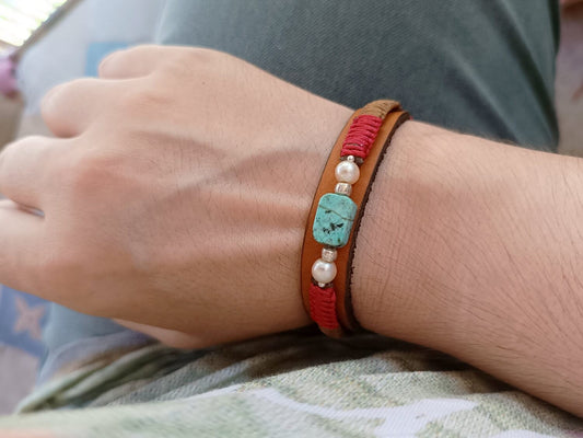 The Ancestral Earth Bracelet worn on wrist, styled with casual neutral outfit for a grounded look