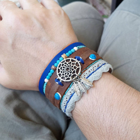 The Extra Wide Dream Catcher Boho Leather Cuff worn on a wrist, demonstrating its substantial width, comfortable fit, and bold bohemian style.