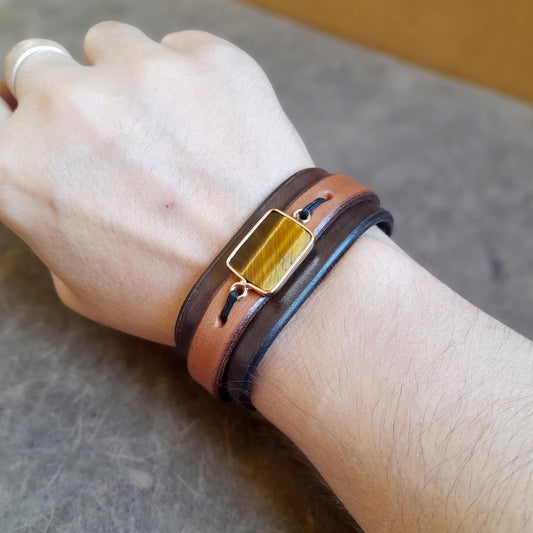 Tiger's Eye leather cuff worn on a wrist, demonstrating fit and stylish presence.