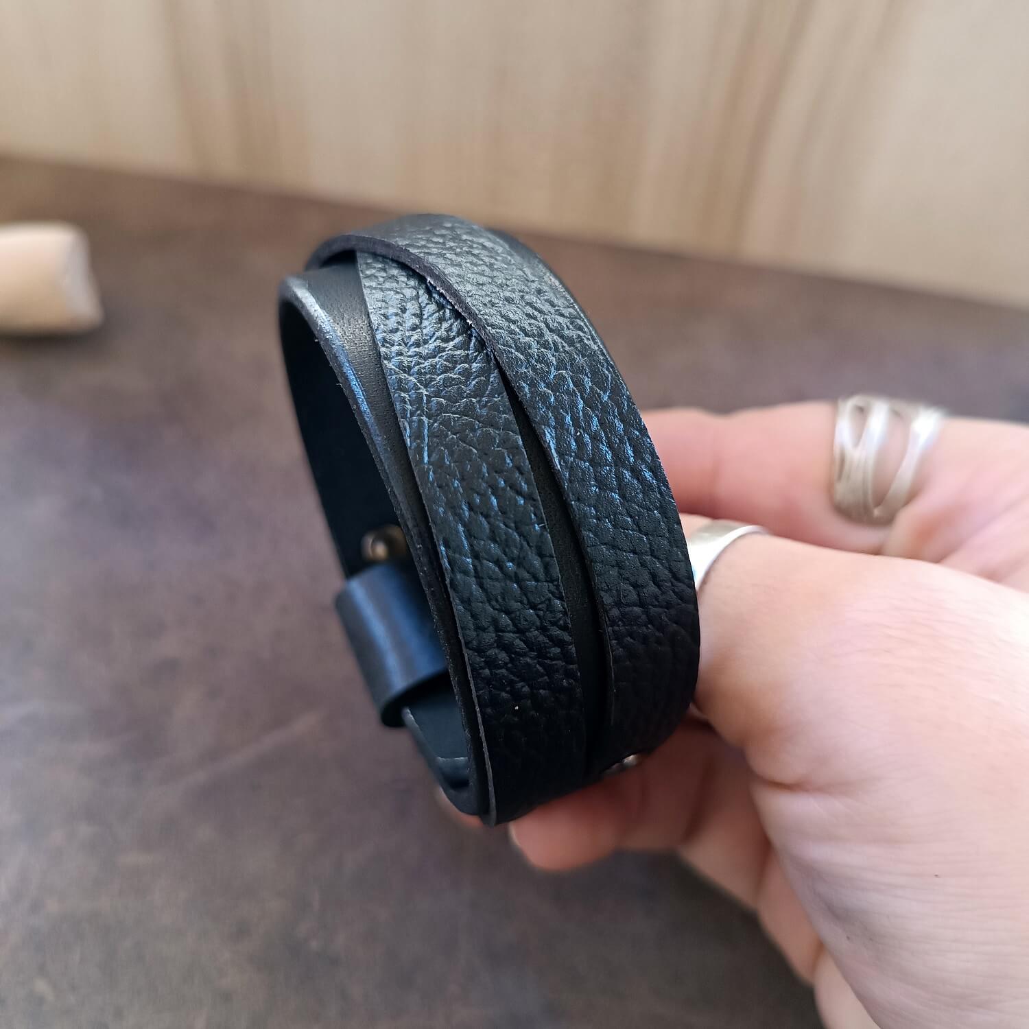 Unisex Wide Black Leather Cuff Bracelet made of premium Vachetta and pebbled leather overlapping straps.