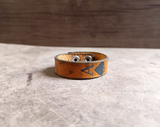 brown lather cuff bracelet with ace of spades