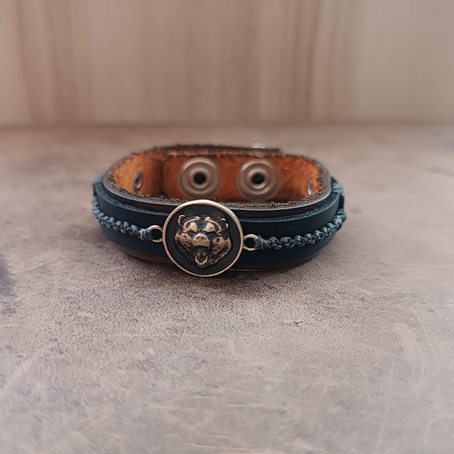 black bear leather bracelet fron flat view