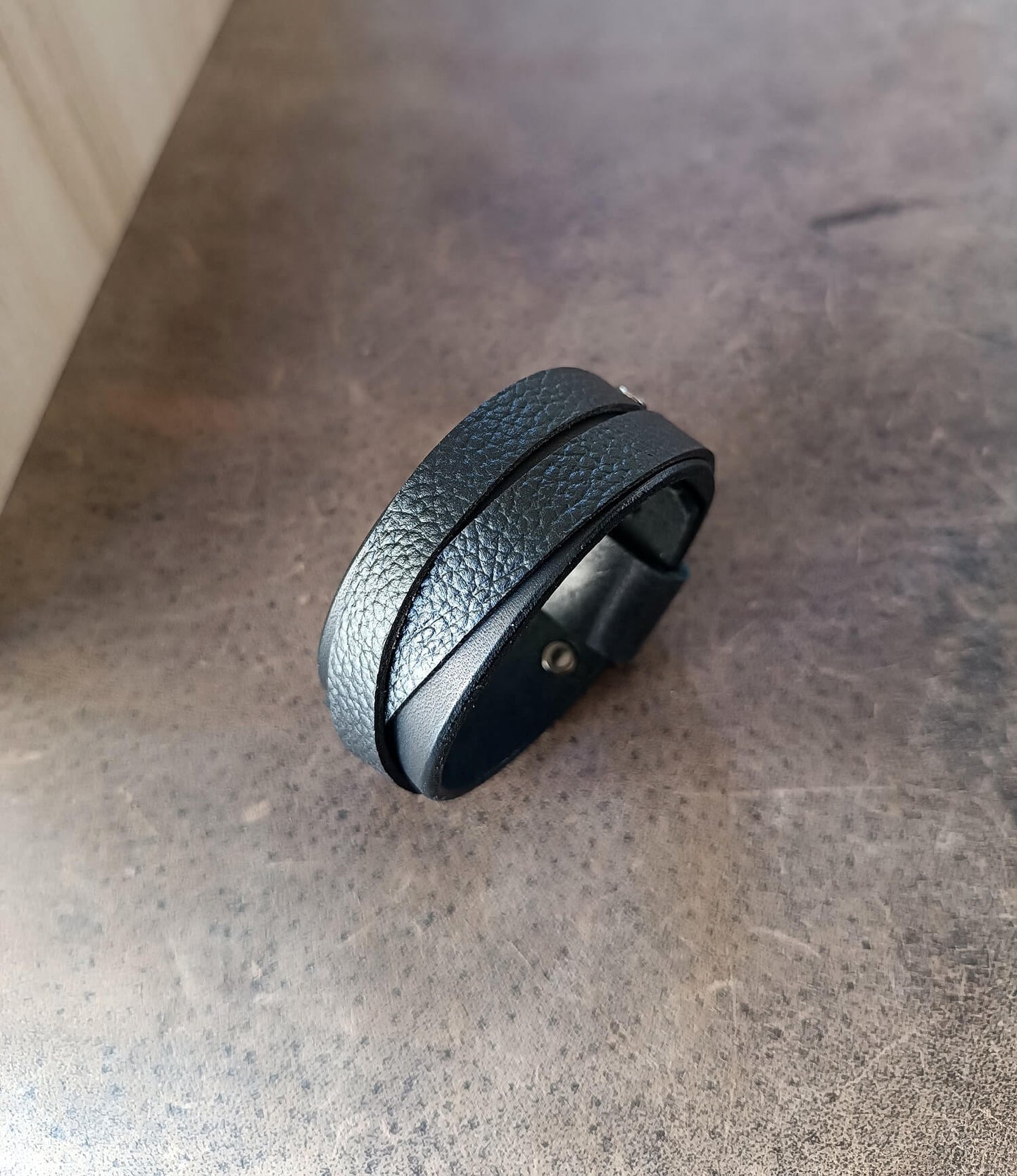 Wide Black Leather Cuff Bracelet for Men made of premium Vachetta and pebbled leather.