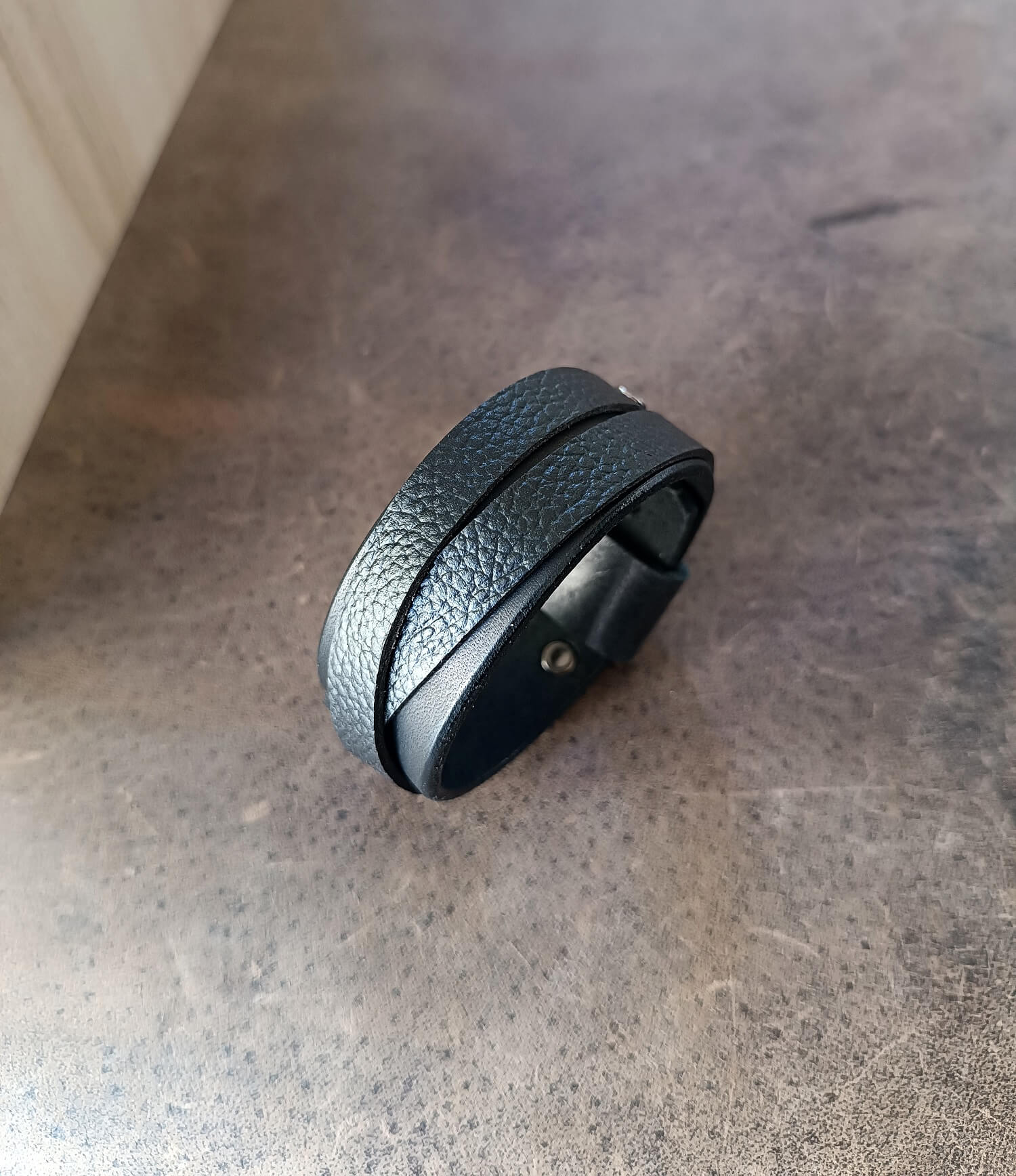 Wide Black Leather Cuff Bracelet for Men made of premium Vachetta and pebbled leather.