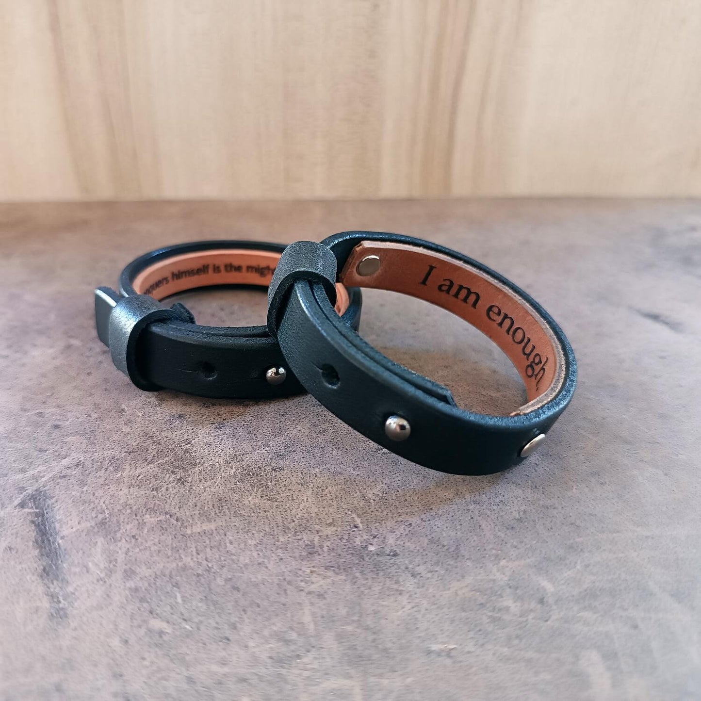 Personalized Black Vachetta Leather Bracelets with custom engraved hidden message, sideview close up