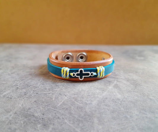 The warm brown Leather bracelet with blue strap and silver cross variation, front view