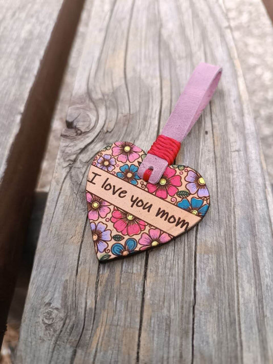 Heart-shaped floral tag with 'I love you mom' text on a wooden surface - finished sample of the free template