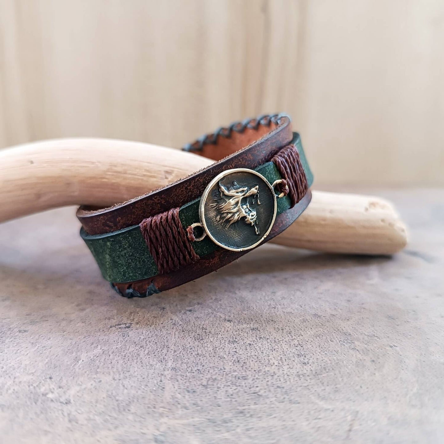 Growling Wolf Bracelet in weathered Brown and khaki close up side view