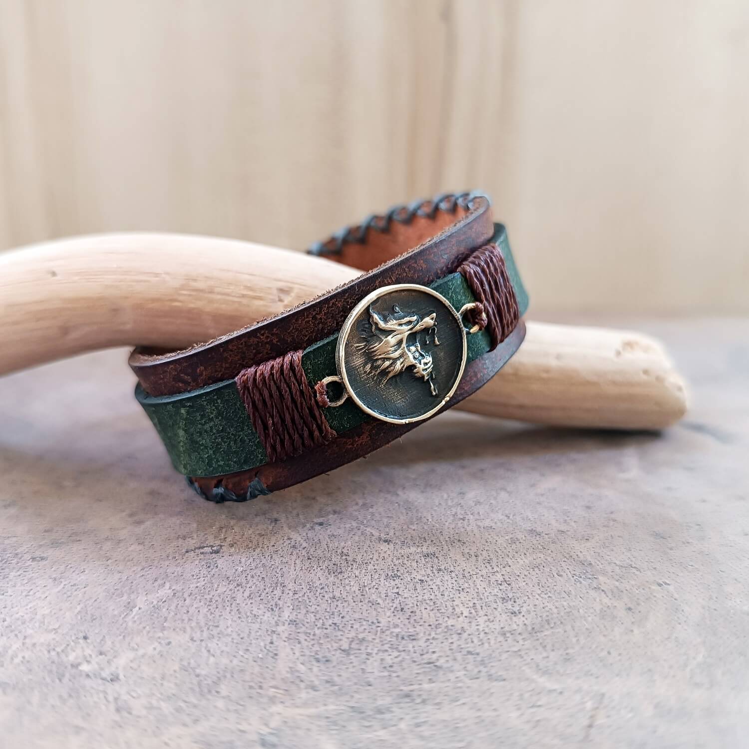 Growling Wolf Bracelet in weathered Brown and khaki close up side view
