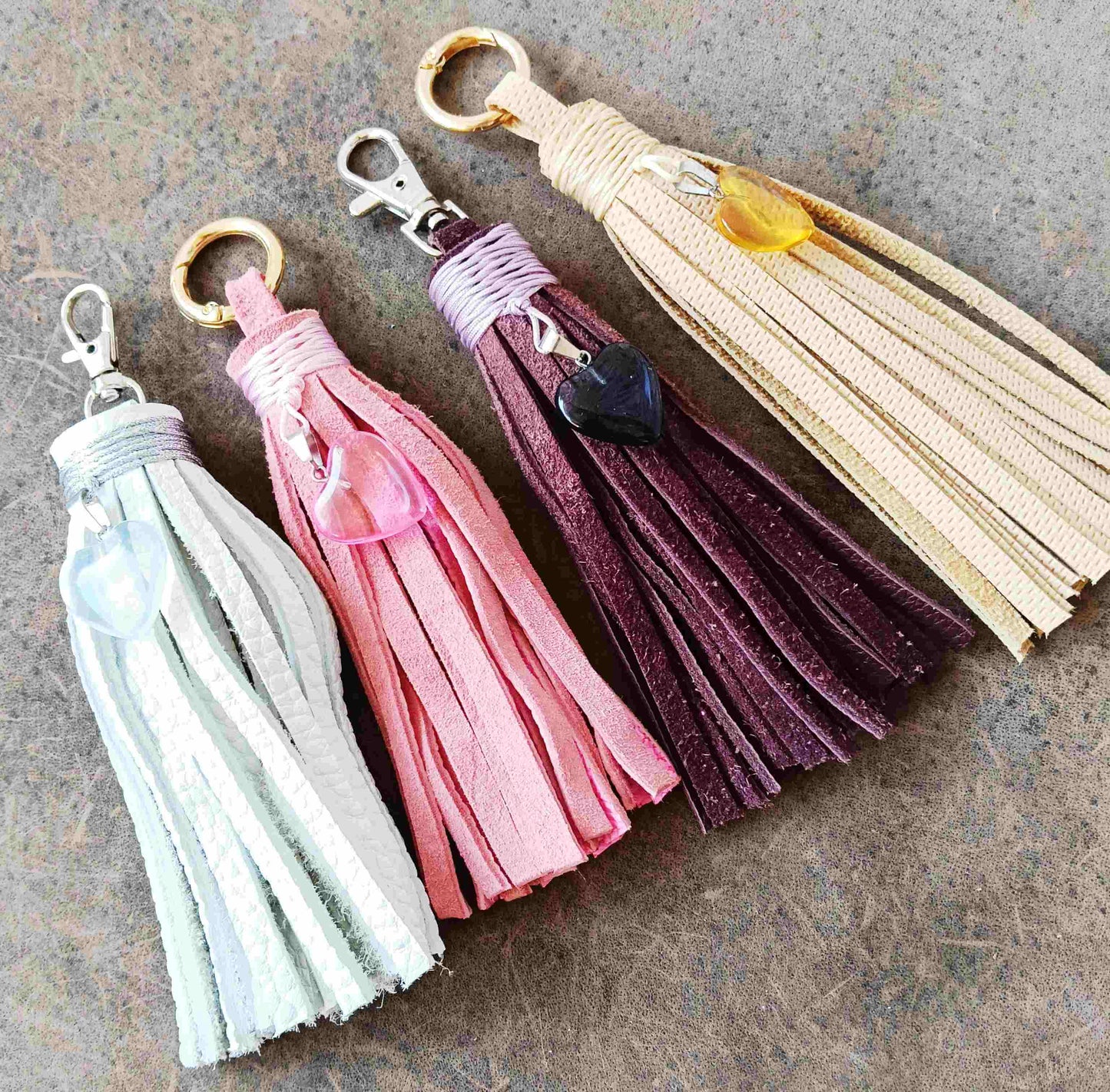 full view of the four heart pendant leather tassel bag charms