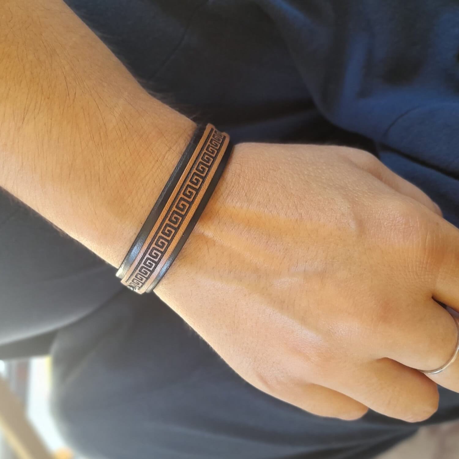Greek meander leather bracelet worn on wrist — minimalist unisex design