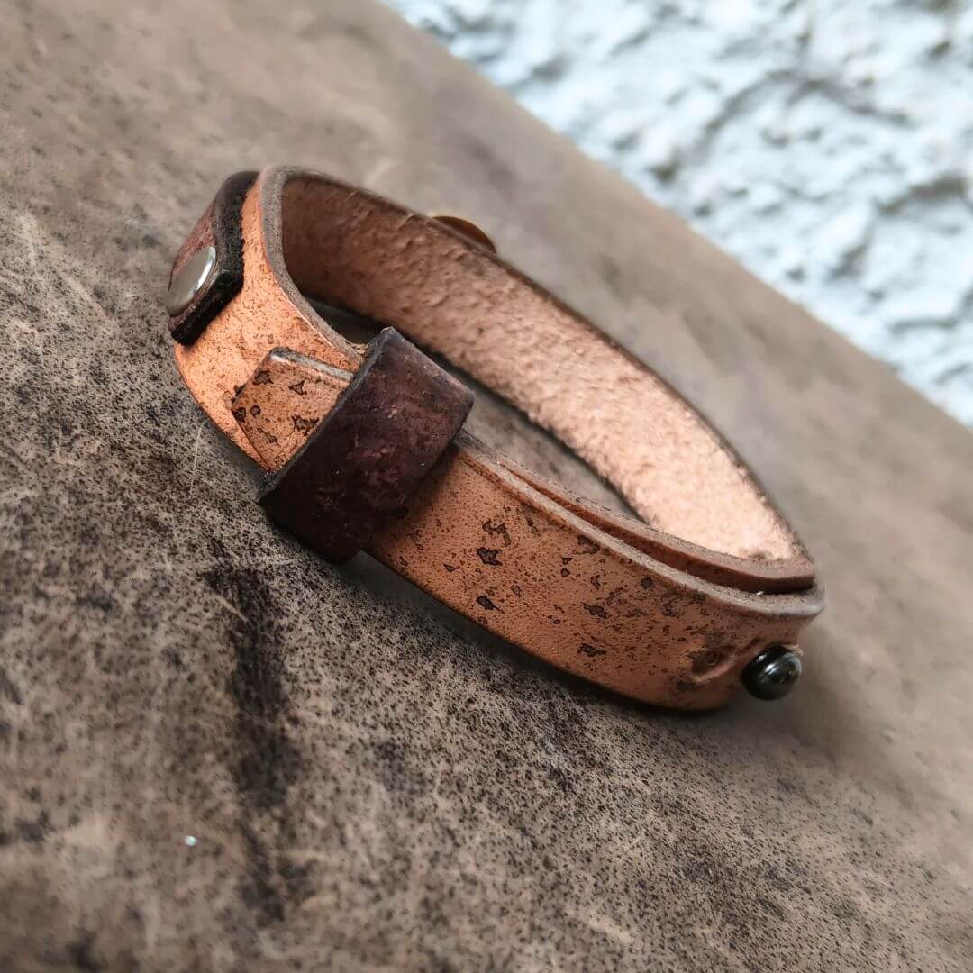 backside view of the ooak brown gold evil eye leather bracelet