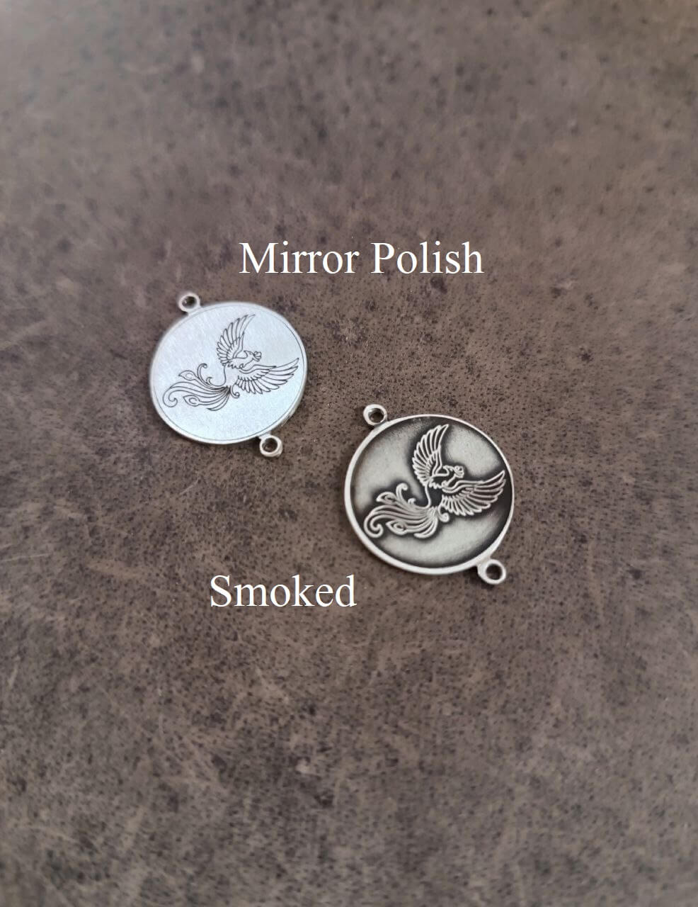 phoenix pendant in two variations, mirror polish and smoked