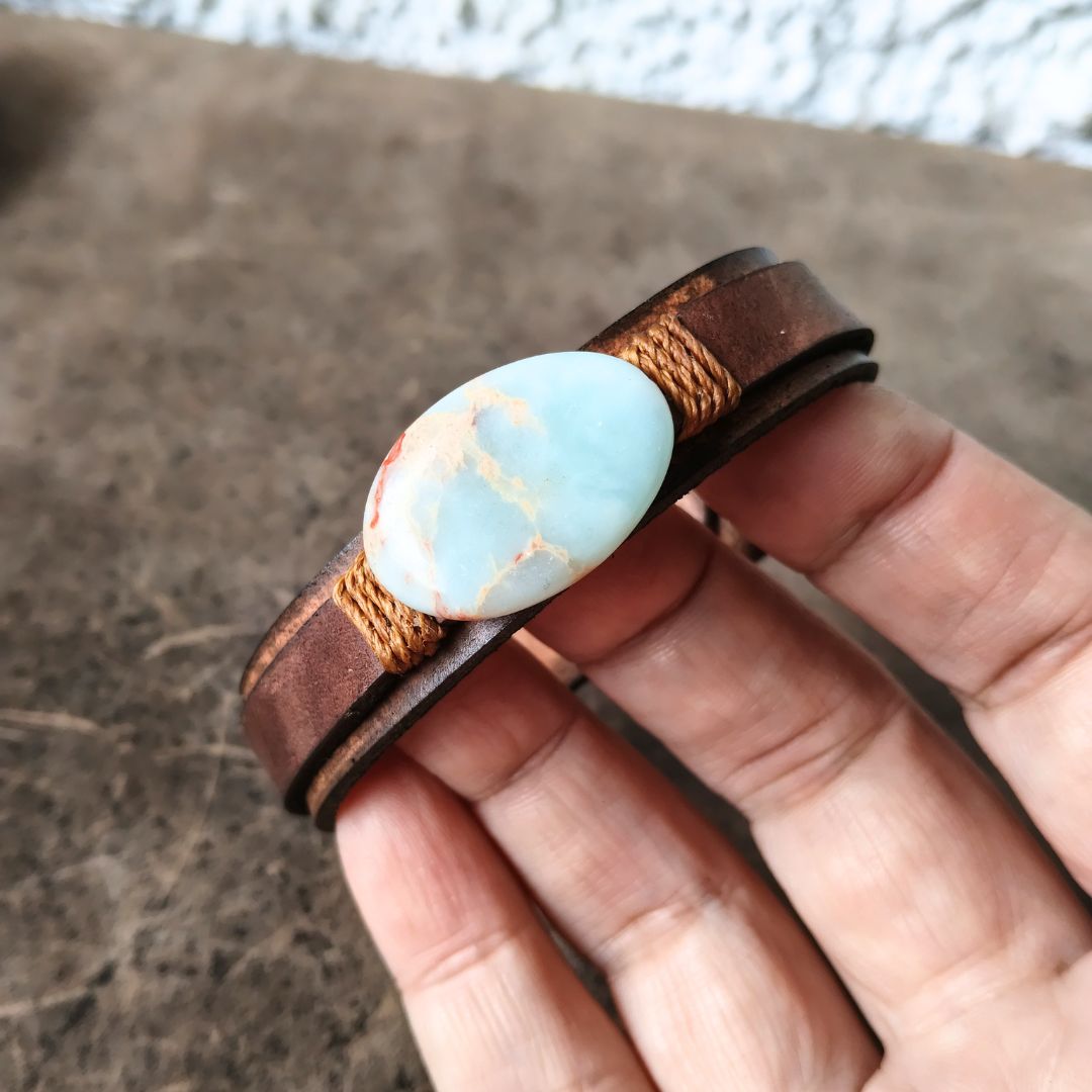shoushan stone leather bracelet held in hand